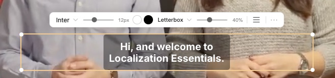 A subtitle selected on the video, with the styling toolbar (font, size, color, background, opacity) and handles for positioning